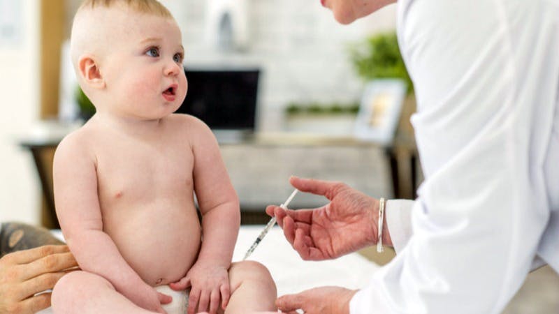 ADMIN2-baby getting vaccine shot