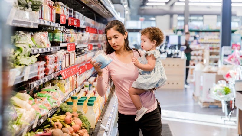 young mother grocery shopping