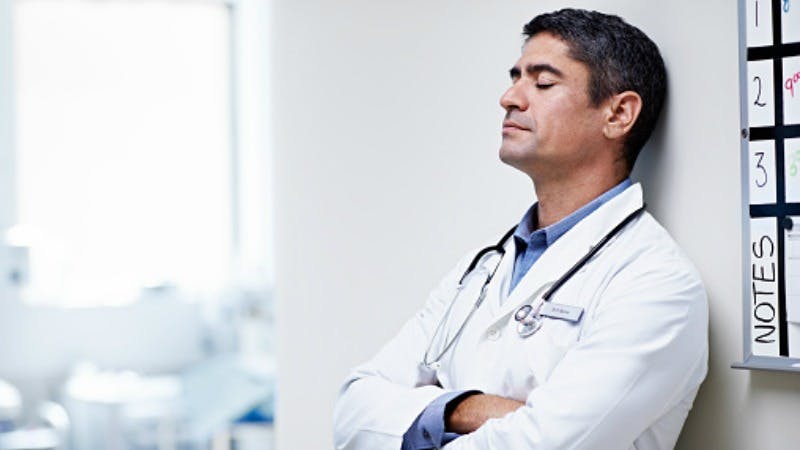 male physician Burnout among oncologists overwhelmed
