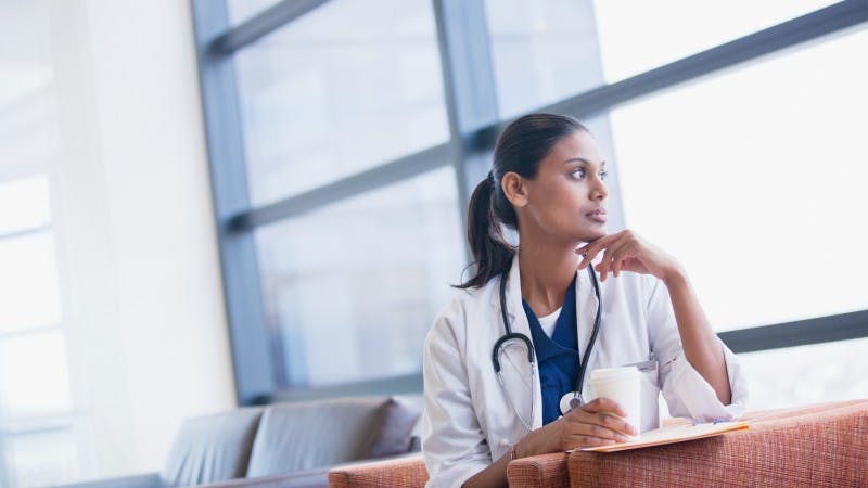resident thinking pensive thoughtful worried overwhelmed doctor